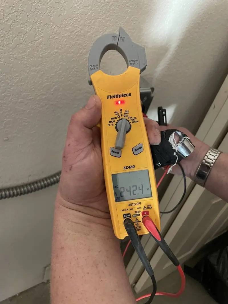 Voltage testing with clamp meter during Recessed Lighting Installation in Forestbrook